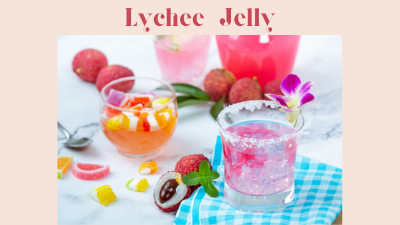 Colorful lychee jelly drinks served with fresh lychees and tropical fruit garnishes on a light table setting