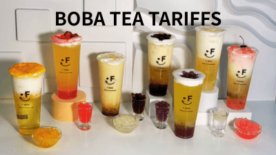 Assorted Bubble Tea Drinks with Colorful Toppings and Fruit Jellies Displayed on a Minimalist White Background