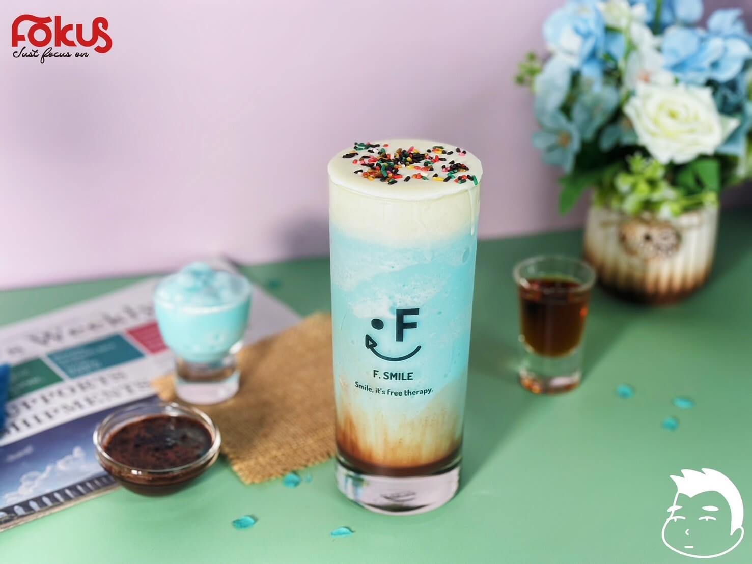 Creamy Blue Chocolate Drink Served with Whipped Cream and Chocolate Drizzle