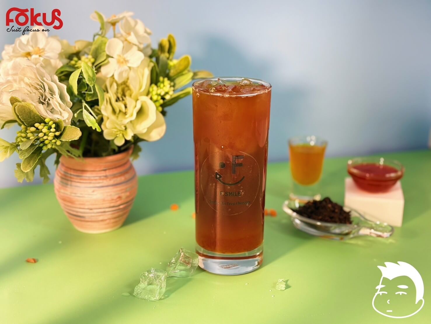 Tropical Ice Tea with pineapple syrup, grapefruit syrup, orange syrup, and Assam black tea over ice